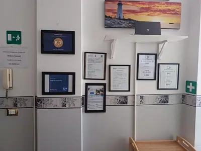 a wall with pictures on it with a laptop on it at B&B Da Ponticello in Rome