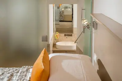 a bathroom with a tub and a sink in a room at Vatican Studio Apartment in Rome