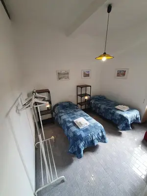 a room with two beds and a treadmill in it at old corallo in Rome