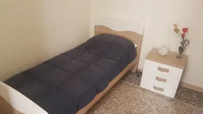 a mirrored closet in a room with a bed at Casa Vacanze Simona vicino a Piazza Navona in Rome