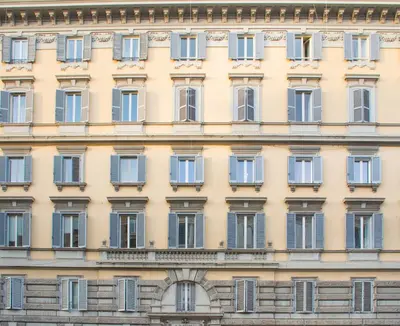 a facade of a building with blue windows at Downtown Accommodation in Rome