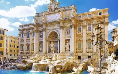 a building with a fountain in front of a building at Downtown Accommodation in Rome