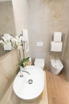 a bathroom with a white sink and a toilet at B&B Smart Rooms in Rome