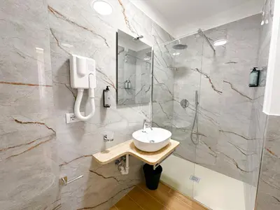 a bathroom with a sink and a shower at B&B Smart Rooms in Rome