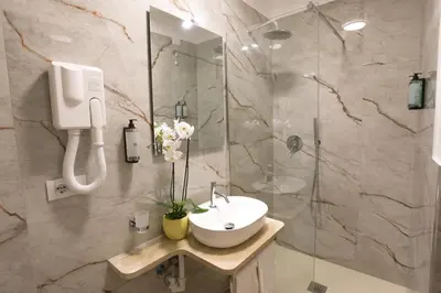 a bathroom with a sink and a shower at B&B Smart Rooms in Rome