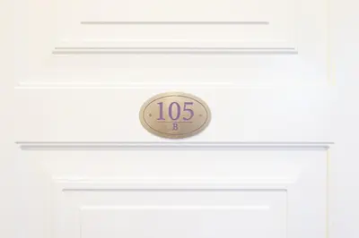 a door with a clock on top of it at La Maison di Sant'Anna in Rome