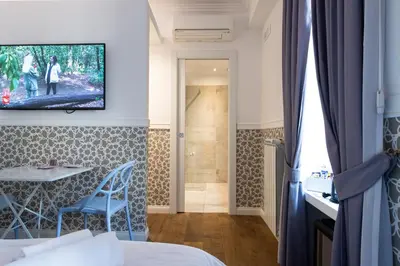 a hotel room with a bed and a bathroom at La Maison di Sant'Anna in Rome