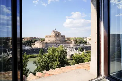 a view of a city from a window at Appartamento a Castel Sant'Angelo con terrazza in Rome