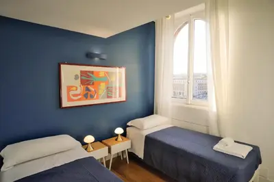 a room with two beds and a window at Appartamento a Castel Sant'Angelo con terrazza in Rome