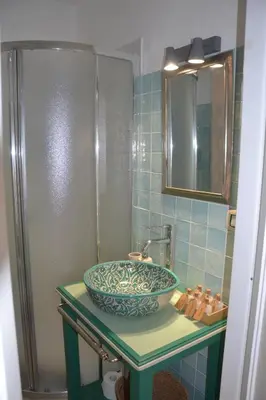 a bathroom with a sink and a shower at Colosseum relax family apartament in Rome