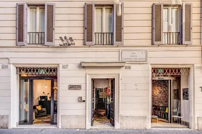 a building with doors and windows on a street at Casa Argileto in Rome