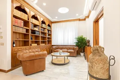 a living room with a couch and a table at First Class Rome Apartments in Rome