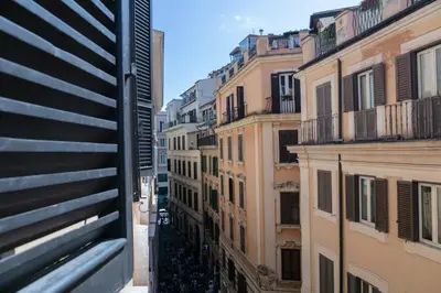 a view of an alley between buildings in a city at Hadrianus Temple Suites - The Venue Collection in Rome