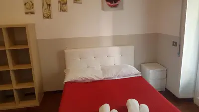 a room with a bed with a red and white mattress at Domus Vatican Holiday's in Rome