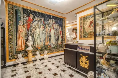 a room with a large tapestry on the wall at Nakissa Inn in Rome