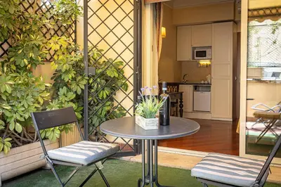 a table and two chairs on a patio at InternoUno Deluxe in Rome