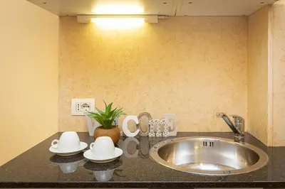a kitchen counter top with a sink and a sink at InternoUno Deluxe in Rome