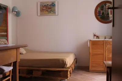 a small bedroom with a bed and a dresser at Hazelrome apartment in Rome