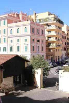a group of buildings in a city with a street at Hazelrome apartment in Rome