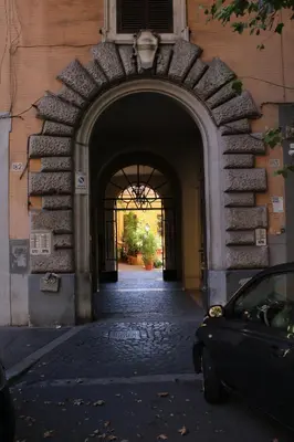 an archway in a building with a car parked under it at Hazelrome apartment in Rome