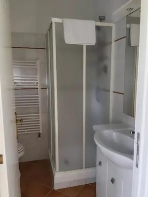 a bathroom with a white sink and a shower at Piramide Gold in Rome