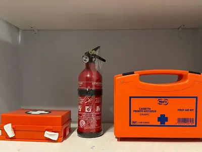 an orange fire extinguisher next to a fire hydrant at Domus Giulio Cesare Apartment in Rome