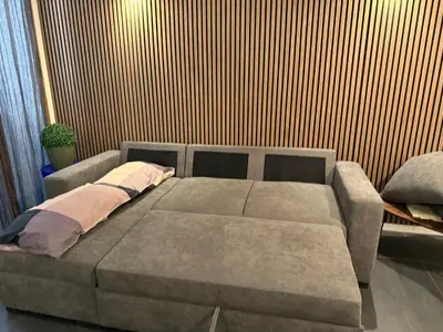 a large couch in a room with a wall at Claudio My House in Rome