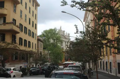a street with cars parked on the side of the road at Easylife in Rome