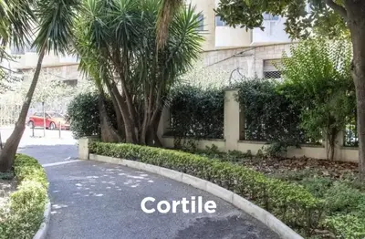 a street in front of a building with trees at Easylife in Rome