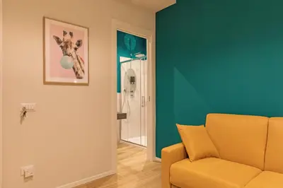 a living room with a couch and a painting of a giraffe at Ziani Vatican Boutique in Rome