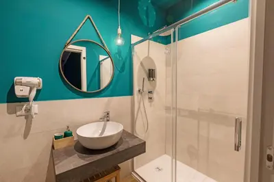 a bathroom with a sink and a shower at Ziani Vatican Boutique in Rome