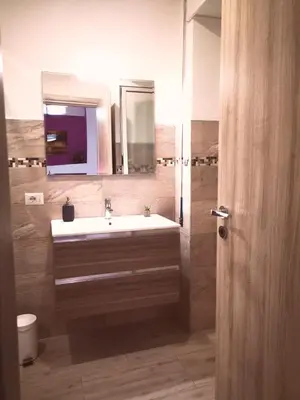 a bathroom with a sink and a mirror at The Royals in Rome