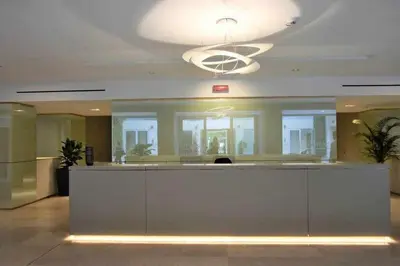 a lobby with a reception desk in a building at AventinoHome in Rome