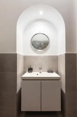 a bedroom with a bed and a window and a mirror at Majestic Trastevere in Rome
