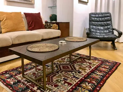 a living room with a coffee table and a couch at Eucalyptus Resort - Roma San Paolo - in Rome