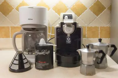 a coffeemaker and a coffee maker on a counter at Eucalyptus Resort - Roma San Paolo - in Rome