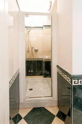 a bathroom with a shower with a glass door at Eucalyptus Resort - Roma San Paolo - in Rome