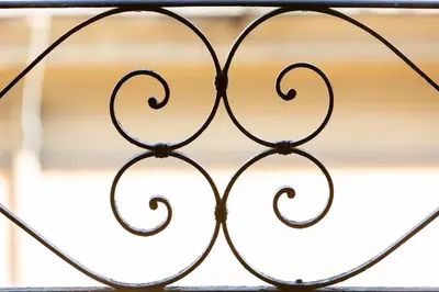 an iron gate in front of a window at MODO Rooms & Suite Rome in Rome