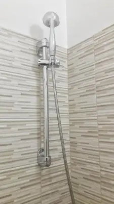 a shower in a bathroom with a shower head at Novaroma by Local Domus in Rome