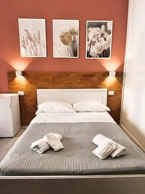 a bedroom with a bed with two towels on it at Novaroma by Local Domus in Rome