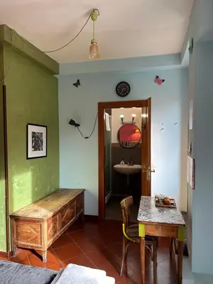 a living room with a table and a table sidx sidx sidx at Signor Suite Colosseo in Rome