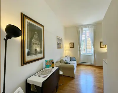 a living room with a couch and a table at Sant’Onofrio - Trastevere Vatican apartment Roma in Rome