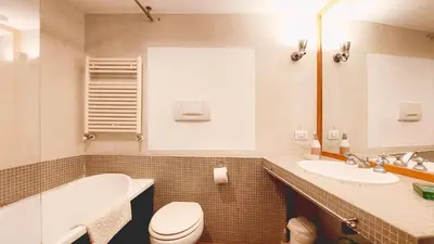 a bathroom with a toilet and a sink at Sant’Onofrio - Trastevere Vatican apartment Roma in Rome
