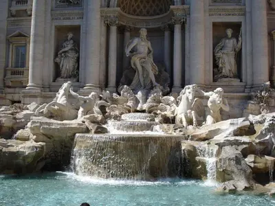 a fountain in front of a building with statues at CASA DONATELLO con TERRAZZO in Rome
