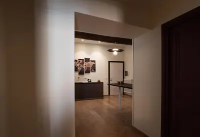 an empty room with a hallway with a table in it at BEIGE ET BLE' GuestHouse in Rome