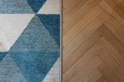a close up of a rug and a wooden floor at BEIGE ET BLE' GuestHouse in Rome