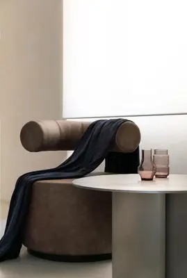 a table with a black blanket on top of a chair at Hotel Scenario in Rome