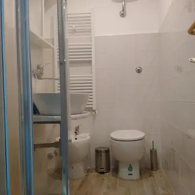 a bathroom with a toilet and a sink at La CasUPOLA Saint Peter's Quiet Room in Rome