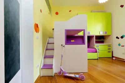 a childs room with a pretend play house at Angelico Family Apartment in Rome