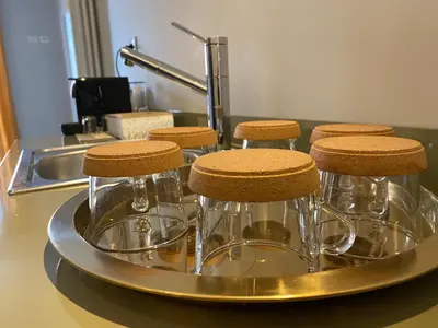a group of stools on a tray next to a sink at Cavour Urban Rooms by GHOR in Rome